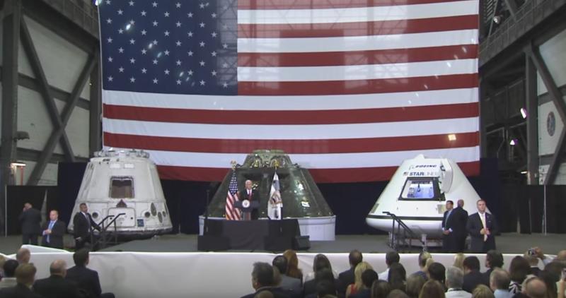 VP Pence speaking at Kennedy Space Center. Background L to R: SpaceX Dragon, Orion EFT-1, and Boeing CST-100 training module. Image credit: NASA