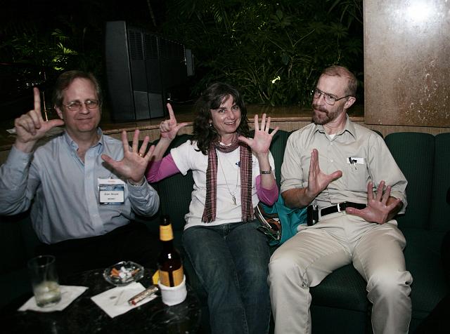 Alan Boyle, Robin Snelson, and Lee Valentine make L5 hand signs late night at the International Space Development Conference 