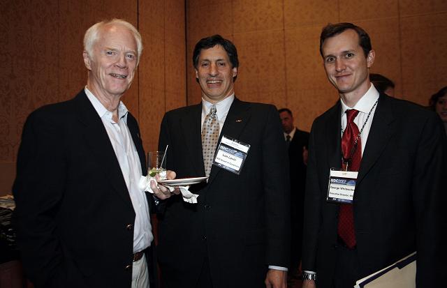 Apollo Astronaut and B612 Foundation founder Rusty Schweickart, Lon Levin, and NSS Executive Director George Whitesides pose at the Space Venture Finance Symposium reception, a part of the International Space Development Conference