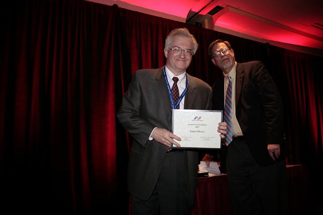 James Plaxco accepts the NSS Award for Excellence from NSS Senior Vice President Mark Hopkins at the International Space Development Conference
