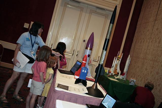 NSS staff give a tour of the space company exhibits to the children of attendees at the International Space Development Conference