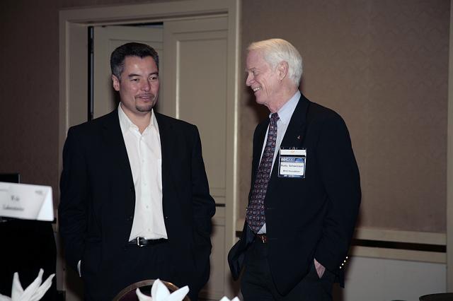 Virgin Galactic's Alex Tai talks with Apollo Astronaut and founder of the B612 Foundation Rusty Schweickart during a luncheon at the International Space Development Conference 